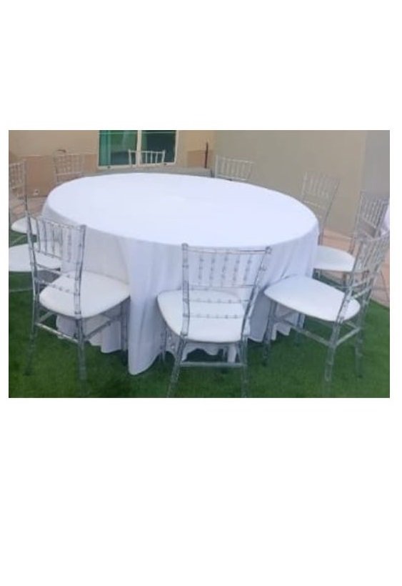 six feet dia round table with white cover surrounded by chairs