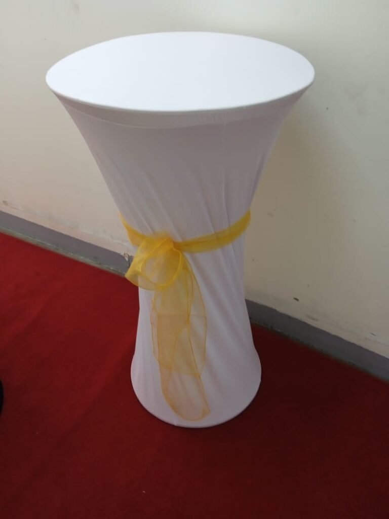 Wooden cocktail table with metal base for event furniture rental Dubai setup.