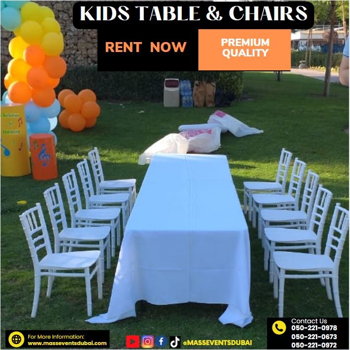 Neat row of white and red kids chairs arranged for a birthday party seating area in an outdoor setting in Dubai
