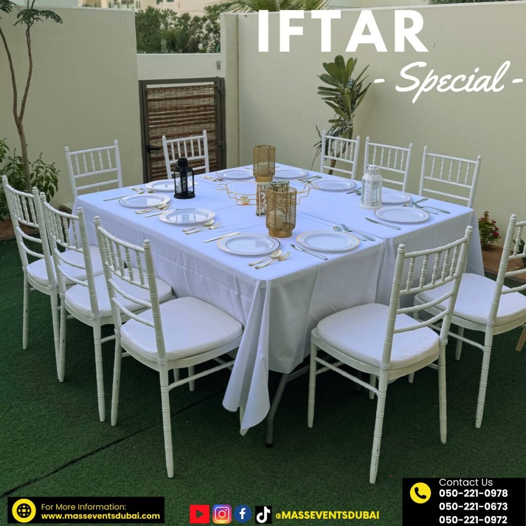 An iftar event setup in a villa with white chairs