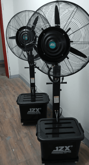 two black colored standing fans