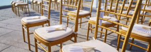 white cushioned golden yellow color chairs